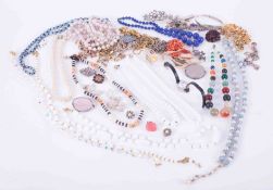 A bag of various costume jewellery.