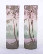 Legras, a pair of French art glass cylindrical vases, each decorated with a tree landscape,