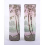Legras, a pair of French art glass cylindrical vases, each decorated with a tree landscape,