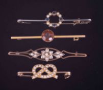 Four gold brooches to include a yellow & white gold (no hallmarks & not tested) bar brooch with a