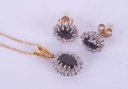 A set comprising of a pair of 9ct yellow & white gold oval cut sapphire & diamond stud earrings with