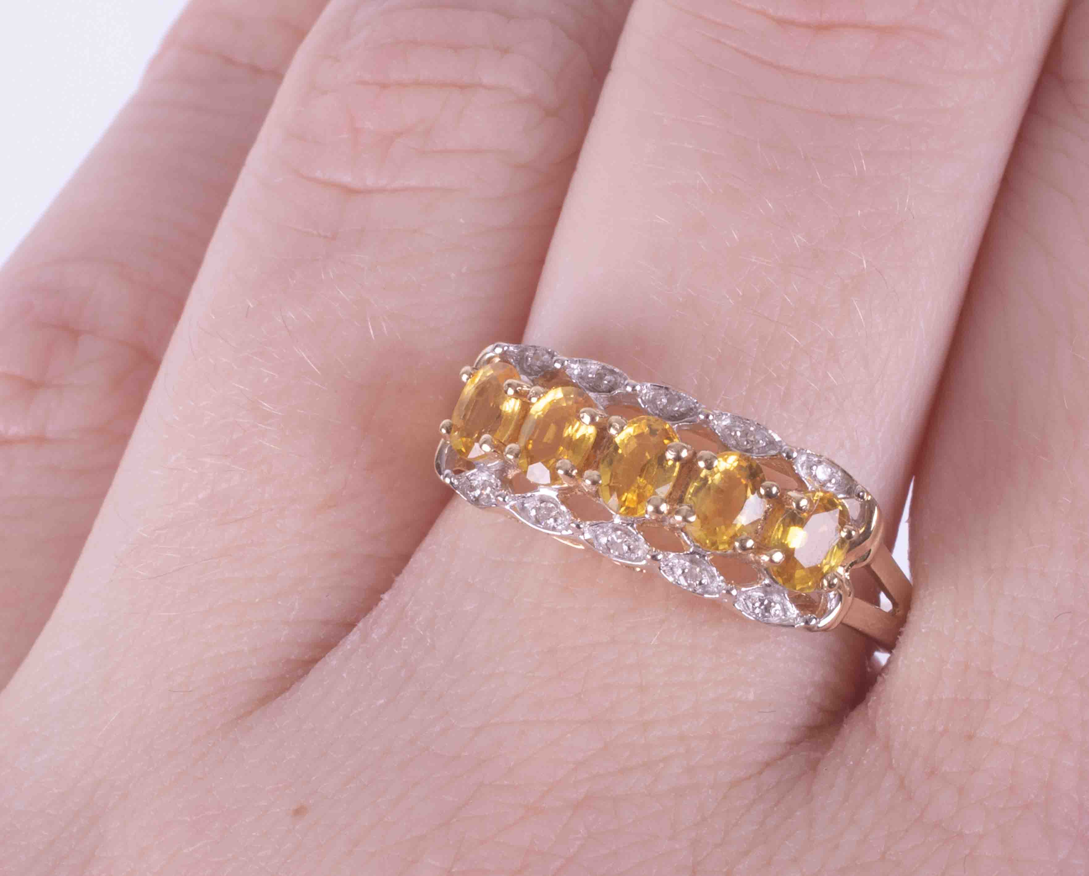 A 9ct yellow and white gold ring set with five oval cut yellow sapphires, approx. total weight 0. - Image 2 of 2