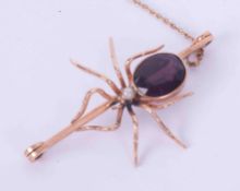 A 9ct rose gold spider brooch set with an oval amethyst measuring approx. 14mm x 11mm and a pearl,