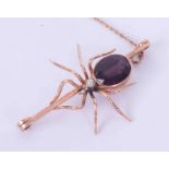 A 9ct rose gold spider brooch set with an oval amethyst measuring approx. 14mm x 11mm and a pearl,