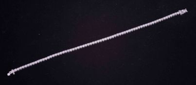 An 18ct white gold line bracelet set with approx. 3.10 carats total weight of round brilliant cut