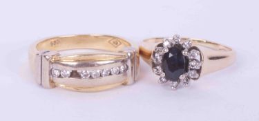 Two 14ct yellow gold rings to include a cluster style set with a central oval cut sapphire