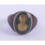 An early 20th Century prisoners? Celluloid ring with a portrait photograph of a lady, 2.37gm,