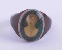 An early 20th Century prisoners? Celluloid ring with a portrait photograph of a lady, 2.37gm,