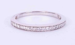 A 9ct white gold half eternity style ring set with 0.16 carats (total weight) of round brilliant cut