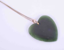 A New Zealand greenstone heart pendant with a 9ct yellow gold bale approx. 5cm x 4.5cm (not
