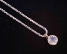 A yellow gold rub over pendant (no hallmarks & not tested) set with an old cut off-round shaped