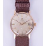 Omega, a 9ct gold vintage automatic date wristwatch with baton dial. Condition reports are offered