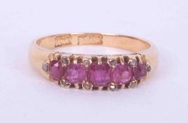 An antique 18ct yellow gold ring set with five cushion cut rubies, total weight approx. 0.82 carats,