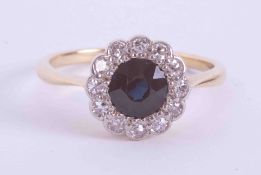 An antique 18ct yellow & white gold cluster ring set with approx. 0.65 carats of round cut sapphire,