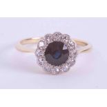 An antique 18ct yellow & white gold cluster ring set with approx. 0.65 carats of round cut sapphire,