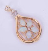 An 18ct yellow gold pendant set with five oval cabochon cut white opals, and five small round cut