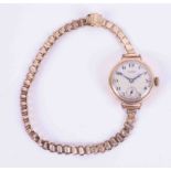 J.W.Benson, a ladies 9ct yellow gold wristwatch (dent to case).