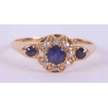 An antique 18ct yellow gold cluster style ring set with 3 round cut sapphires, total weight