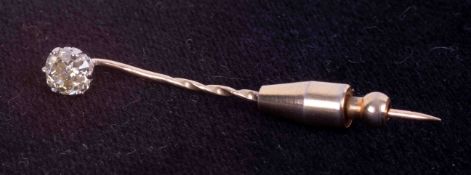 A yellow gold (not hallmarked or tested) stick pin set with an old cushion cut diamond, approx. 0.90