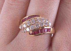 An 18ct yellow gold ring set centrally with two rows of round brilliant cut diamonds, total