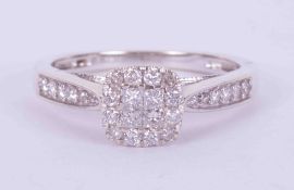 A 9ct white gold cluster style ring set with 0.33 carats total weight of round & princess cut