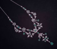 An Edwardian gold (not hallmarked or tested) ornate flower design necklace set with old cut diamonds