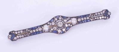 An impressive antique brooch set with old round cut diamonds, a mixture of cuts of sapphires and two