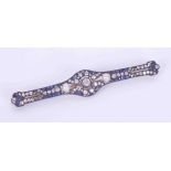 An impressive antique brooch set with old round cut diamonds, a mixture of cuts of sapphires and two