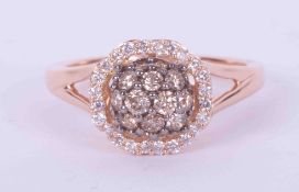 A 14k rose gold split shoulder ring by Le Vian with round brilliant cut chocolate diamonds set