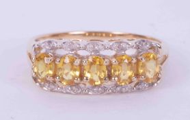 A 9ct yellow and white gold ring set with five oval cut yellow sapphires, approx. total weight 0.