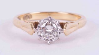 An 18ct yellow & white gold solitaire ring set with approx. 0.28 carats of round brilliant cut