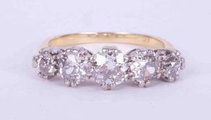 An 18ct yellow & white gold five stone ring set approx. 2.20 carats total weight of older round