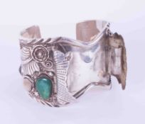 A silver ornate engraved Navajo cuff bangle signed L. Elthe set with gemstones including turquoise