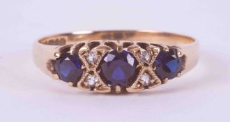 A 9ct yellow gold ring set with three round cut sapphires, total weight approx. 0.60 carats