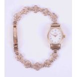 Omega, a vintage ladies quartz 9ct yellow gold Omega dress watch with a white oval face and a
