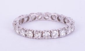 A white gold (no hallmarks & not tested) full eternity ring set with approx. 1.06 carats of round