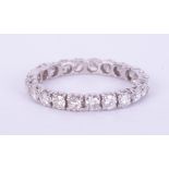 A white gold (no hallmarks & not tested) full eternity ring set with approx. 1.06 carats of round