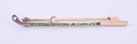 A yellow & white gold Golf Club design brooch set with an old rough cut diamond, square cut emeralds