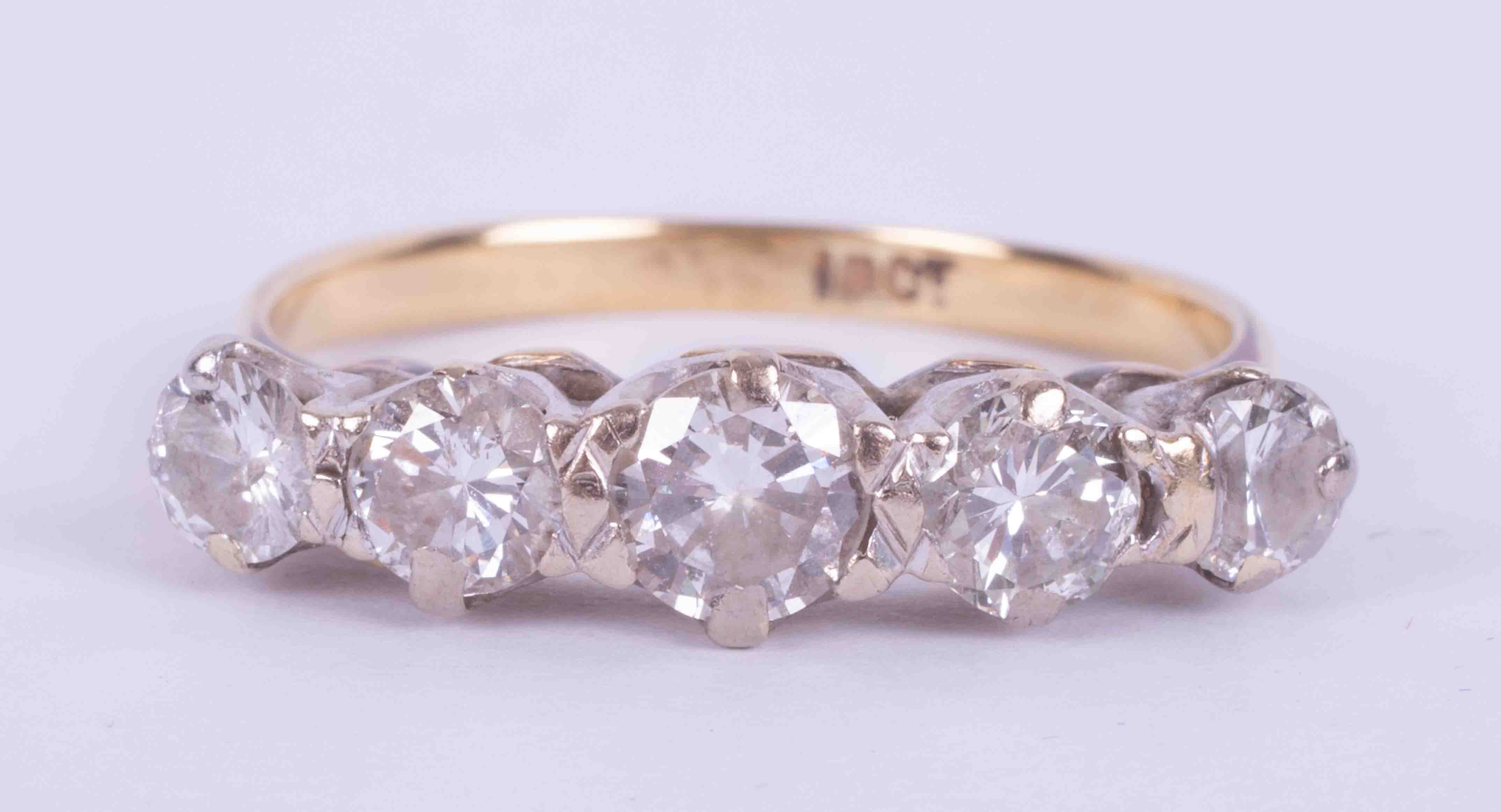An 18ct yellow gold five stone ring set with old round cut diamonds, approx. total weight 1.00 carat
