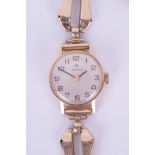 Tissot, a ladies 9ct manual wind wristwatch with 9ct gold bracelet, overall weight 18.8gms.
