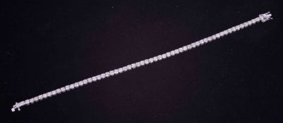 An 18ct white gold line bracelet set with approx. 5.50 carats of round brilliant cut diamonds,