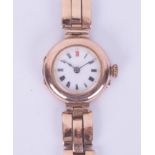 A ladies vintage 9ct gold wristwatch and bracelet, the enamel dial with red twelve, roman