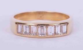 An 18ct yellow gold half eternity style ring set with seven baguette cut diamonds, approx. 0.70