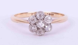 An 18ct yellow gold flower cluster ring set with seven old cut round diamonds, approx. 0.45 carats
