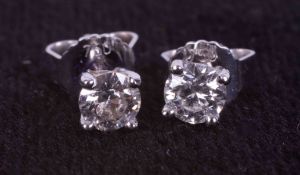 A pair of 18ct white gold four claw stud earrings set with 0.40 carats of round brilliant cut
