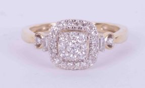 A 9ct yellow gold square cluster style ring set with round brilliant cut diamonds and baguette cut