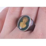 An early 20th Century prisoners? Celluloid ring with a portrait photograph of a lady, 2.37gm,