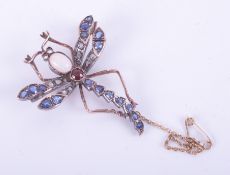A rose & white gold (not hallmarked or tested) dragonfly brooch with a yellow gold safety chain, set