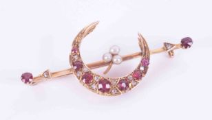 A yellow gold (not hallmarked or tested) bar brooch with a half moon & arrow design, set with oval &