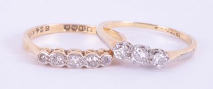 Two 18ct yellow gold rings to include a five stone diamond ring, 1.76gm, size L and a three stone